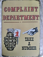 metalen_wandbord_tekst_complaint_department_take_a_number